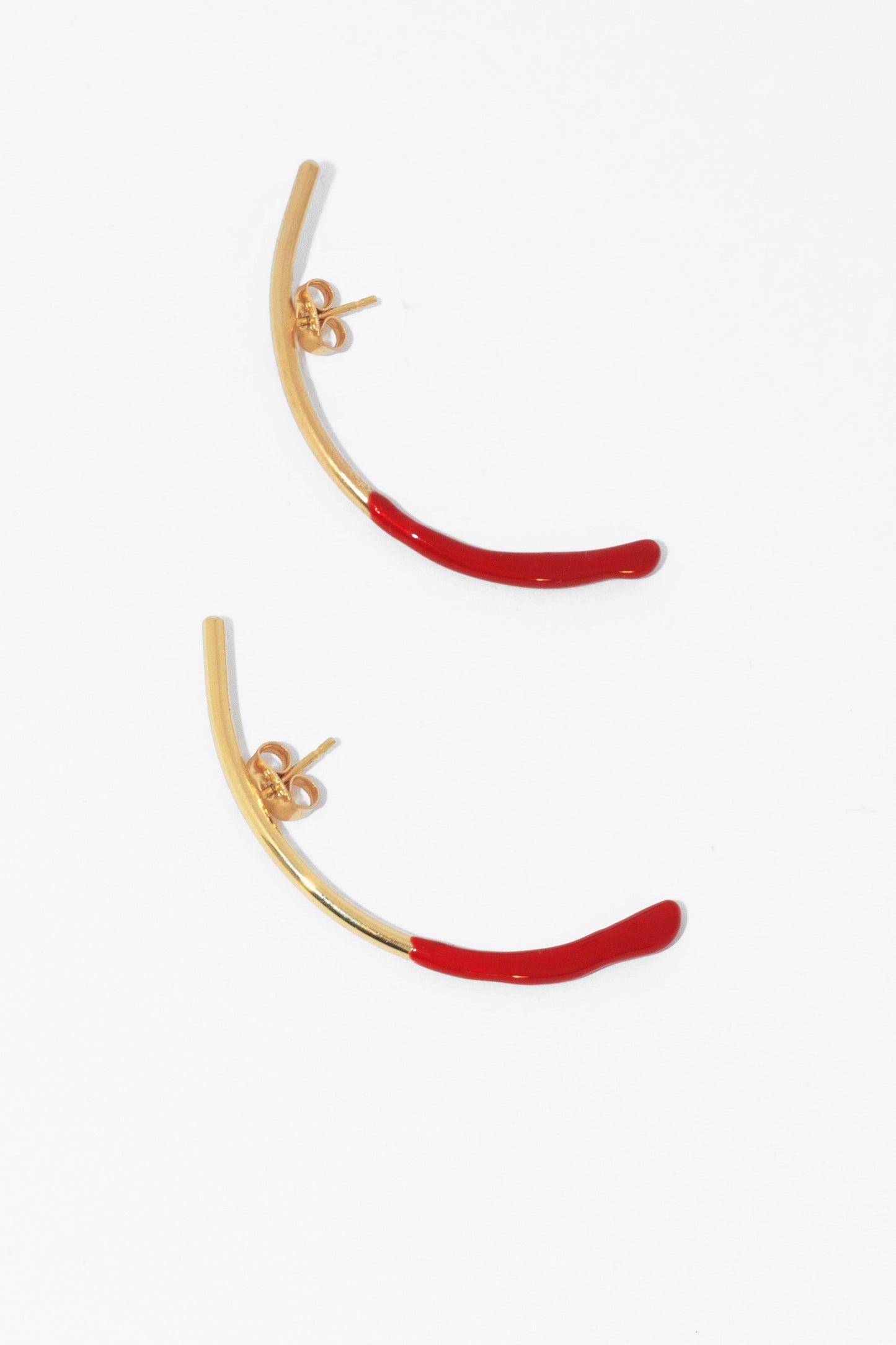 Bow earring with a hint of red