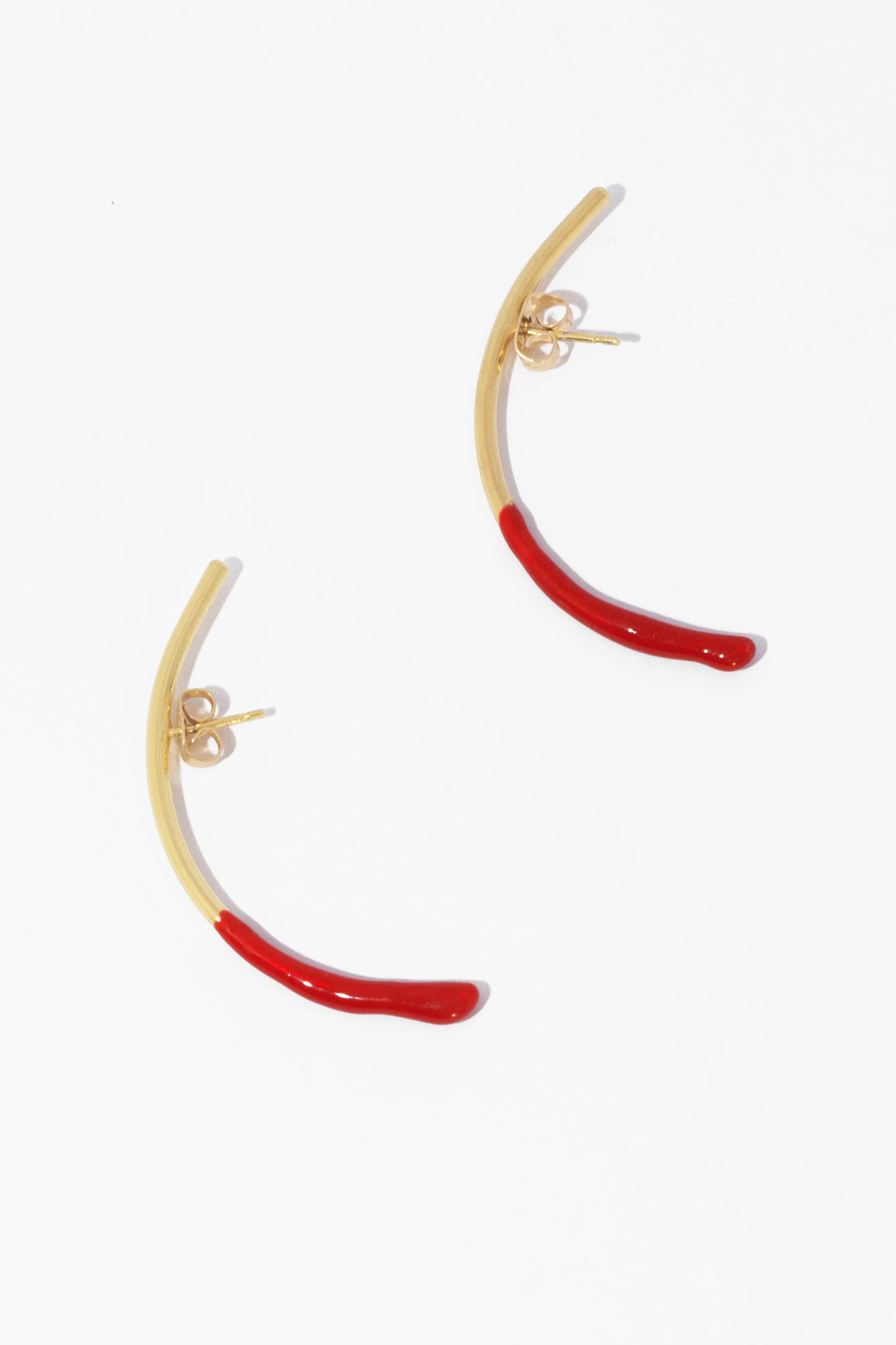 Bow earring with a hint of red