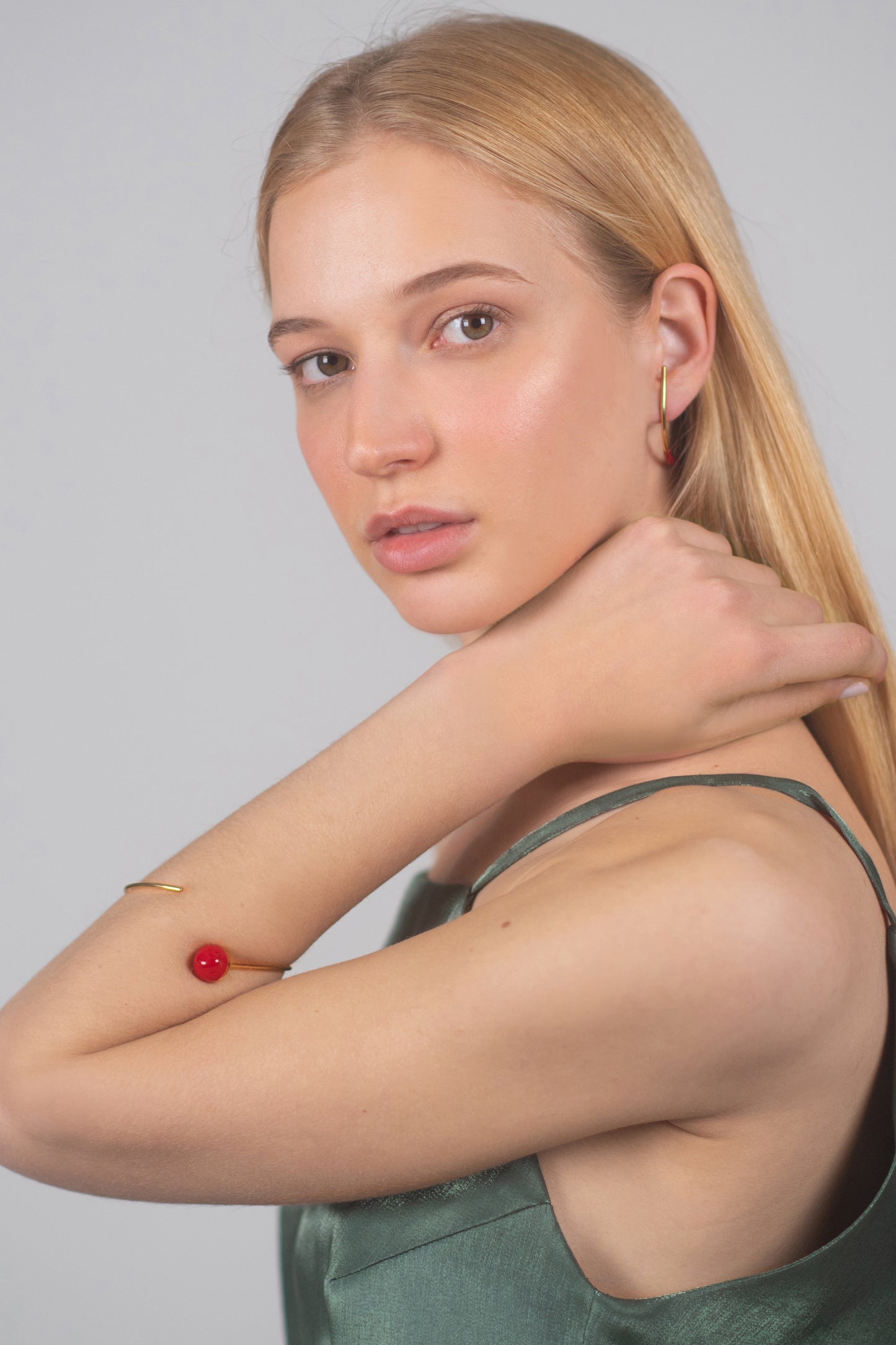 Bow earring with a hint of red