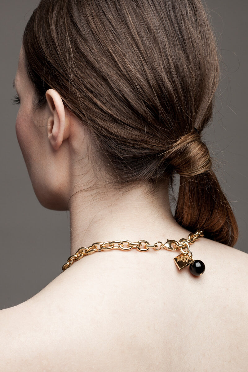 Anchor necklace is made of 24K gold-plated brass.