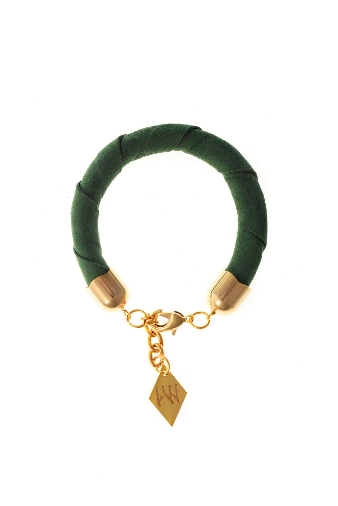 The no. 18 edition of the handcuff bracelet is made of green suede with galvanized metal components. Gold edition.