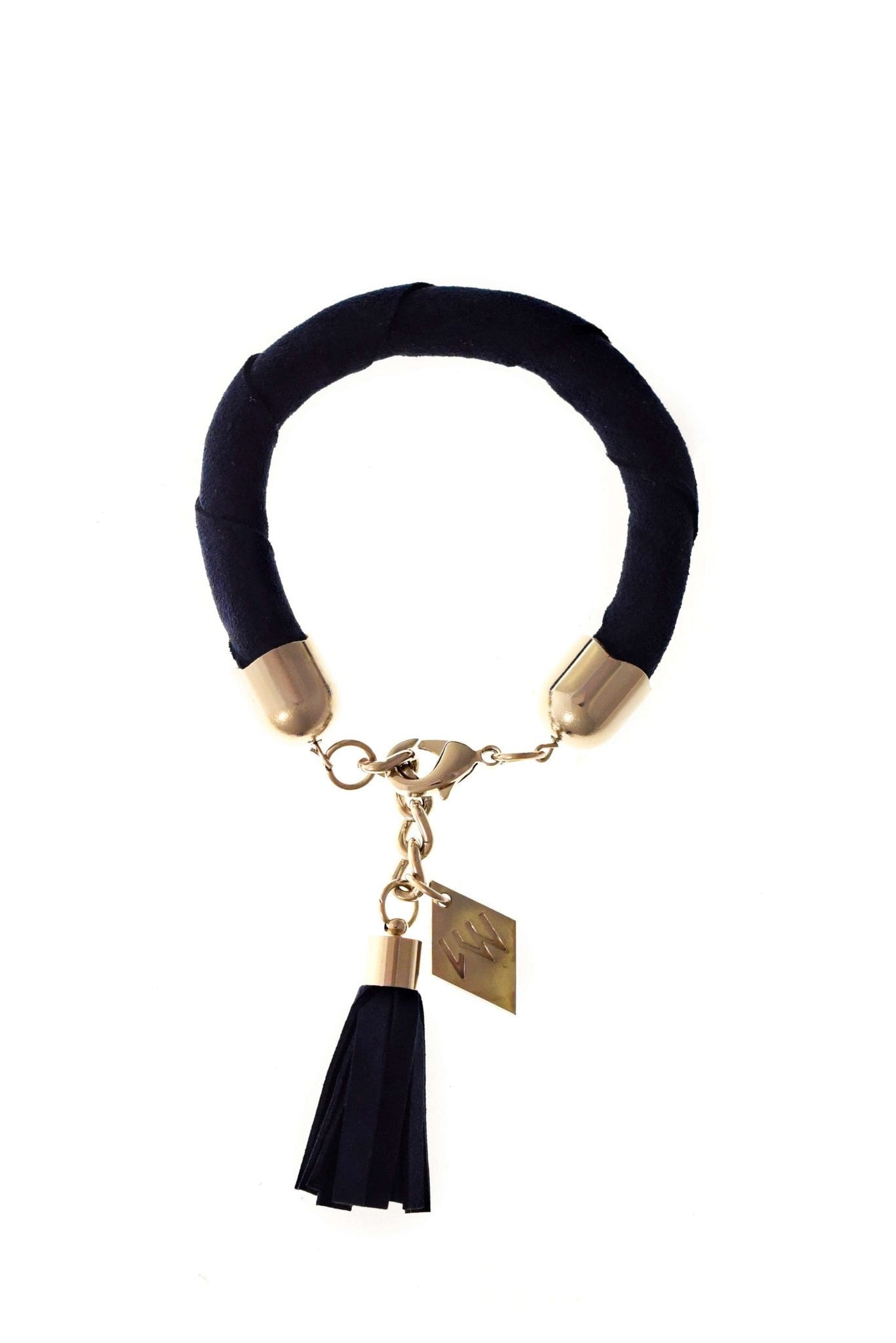 The no. 11 edition of the handcuff bracelet is made of navy blue suede with galvanized metal components with leather tassel. Silver edition.