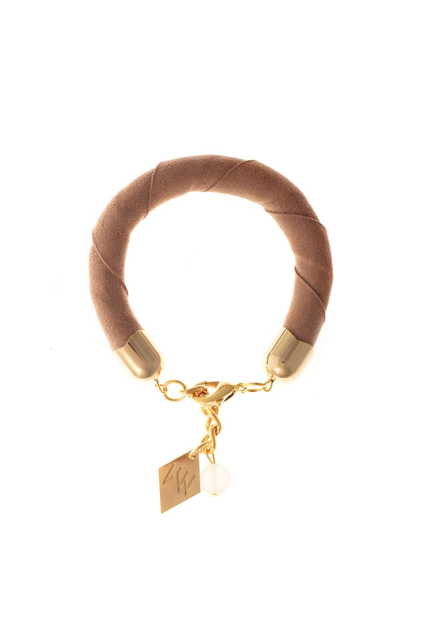 The no. 5 edition of the handcuff bracelet is made of beige suede with galvanized metal components without leather tassel. Gold edition.