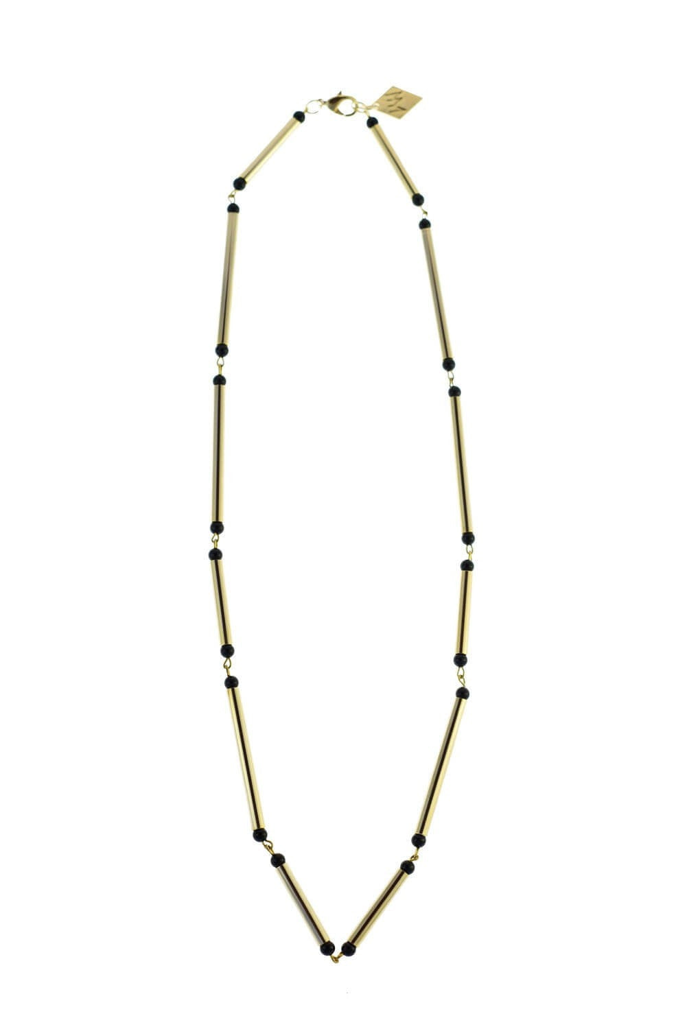 Hidden lines gold edition made of hand-cut, hand polished and galvanized brass featuring black onyx.