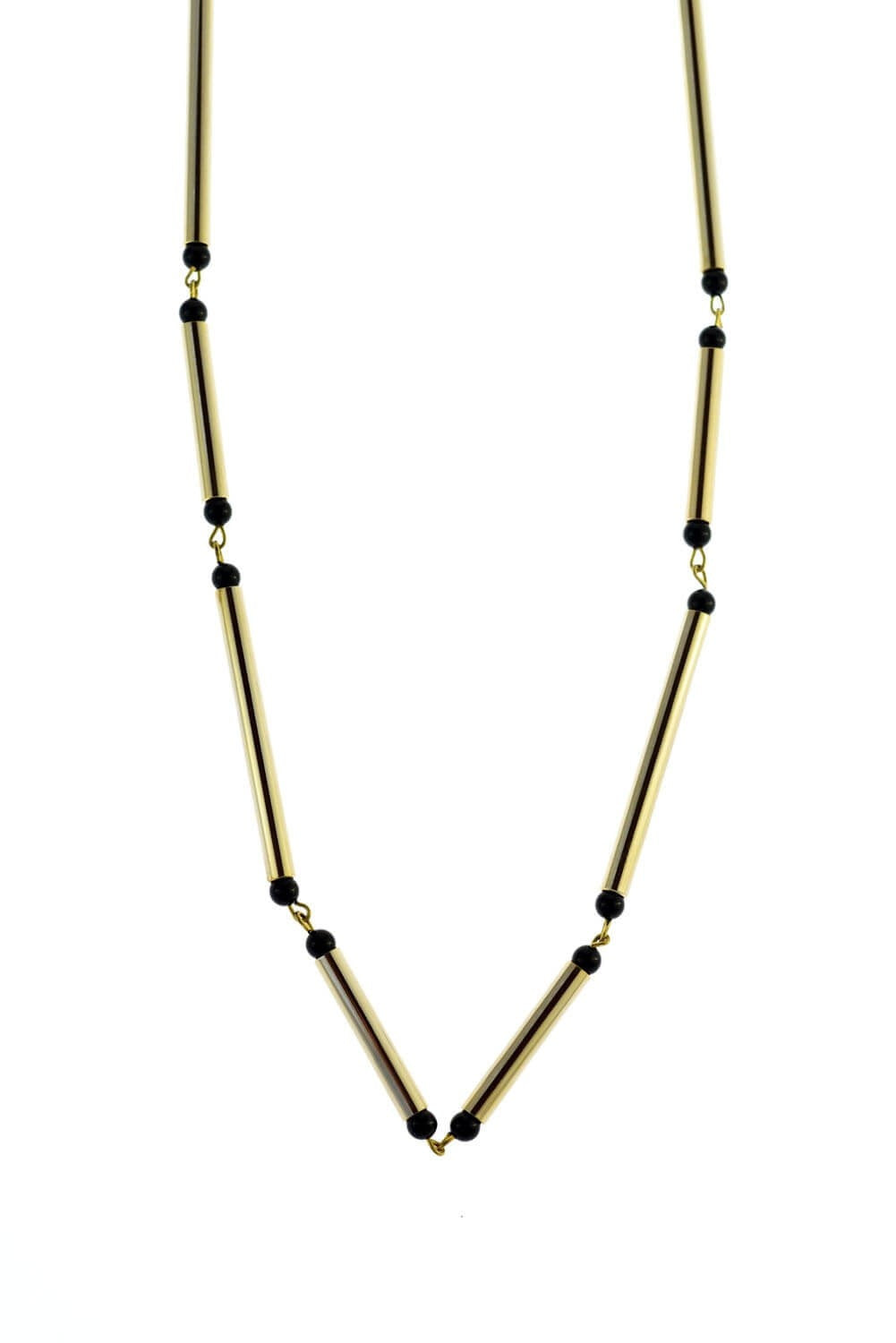Hidden lines gold edition made of hand-cut, hand polished and galvanized brass featuring black onyx.