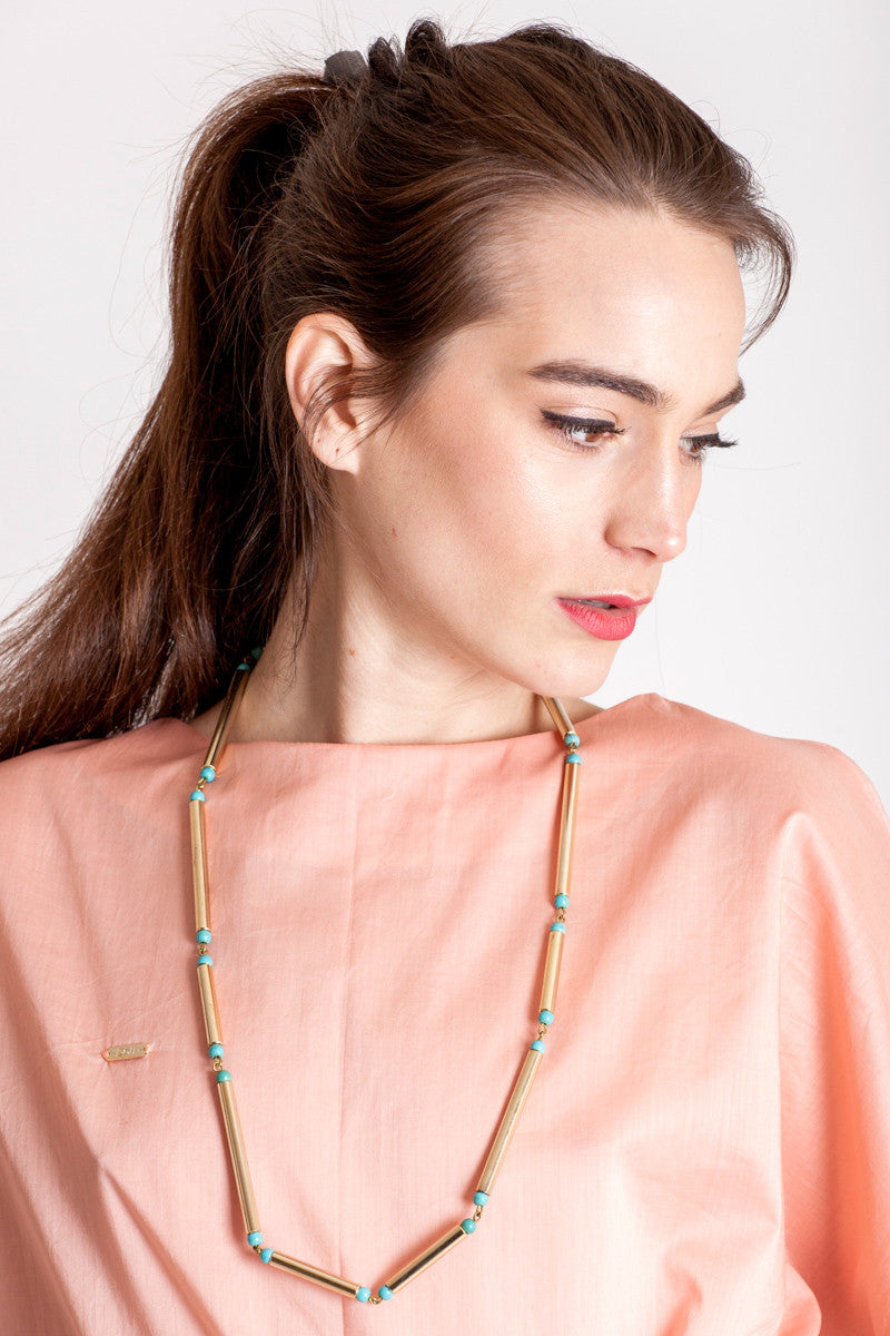 Hidden lines long necklace made of hand-cut, hand polished and galvanized brass featuring turquoise.