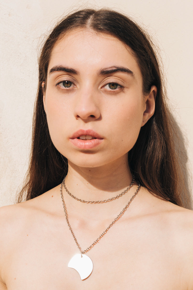 Long necklace made of hand cut and galvanized brass and chain.