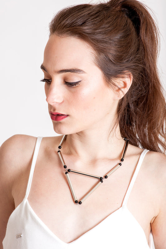 Aztec necklace is made of hand-cut and galvanized brass, onyx and galvanized metal components.