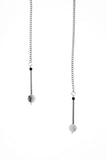 The Bellevue necklace features hand-cut and galvanized brass, onyx, rutilated quartz and galvanized chain.