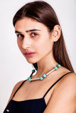The Bonbon necklace made of warm turquoise (silver edition) and cold brass, which was hand-cut and galvanized.
