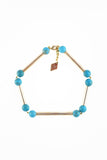 The Bonbon necklace made of warm turquoise (gold edition) and cold brass, which was hand-cut and galvanized.