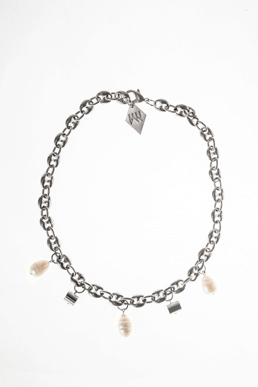 This necklace features galvanized chain called coffee beans chain and hand cut and galvanized brass and freshwater pearls.