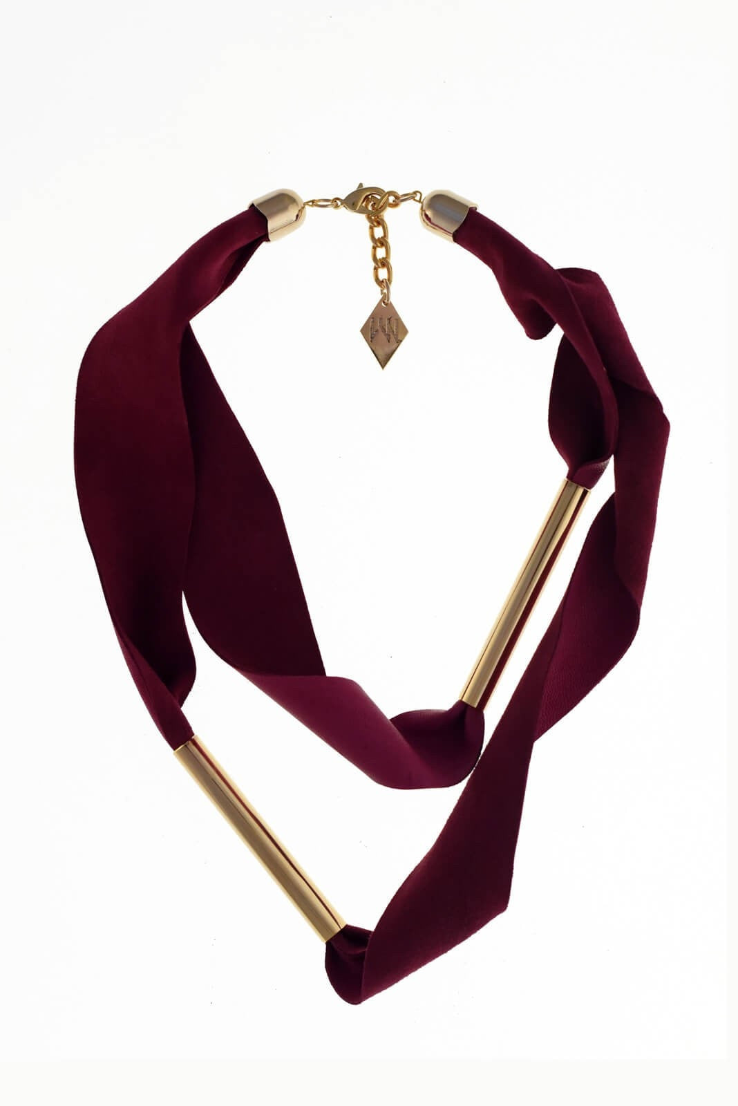 Embrassme necklace made of finest sheep napa, hand-cut, hand polished and galvanized brass and metal components. Purple-gold edition.
