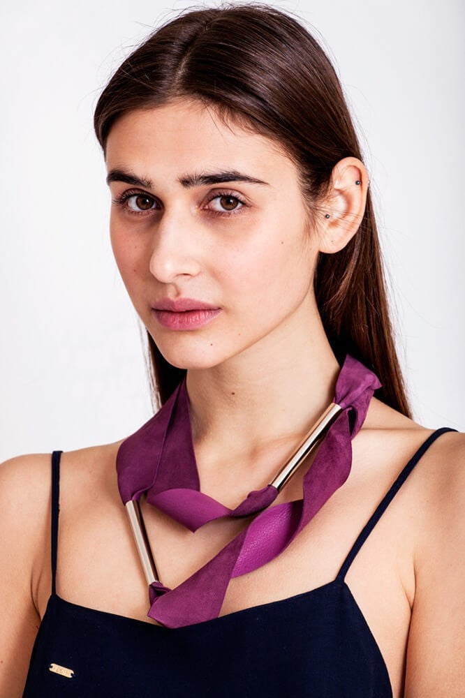 Embrassme necklace made of finest sheep napa, hand-cut, hand polished and galvanized brass and metal components. Purple-gold edition.