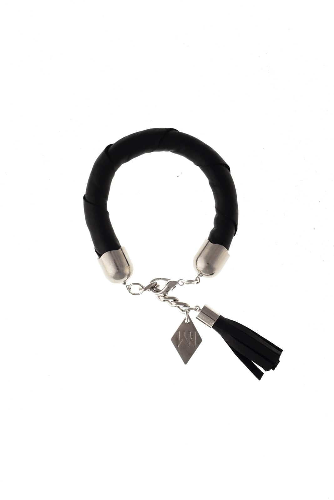 The no. 4 edition of the handcuff bracelet is made of black leather with galvanized metal components and leather tassel. Silver edition. Silver edition.