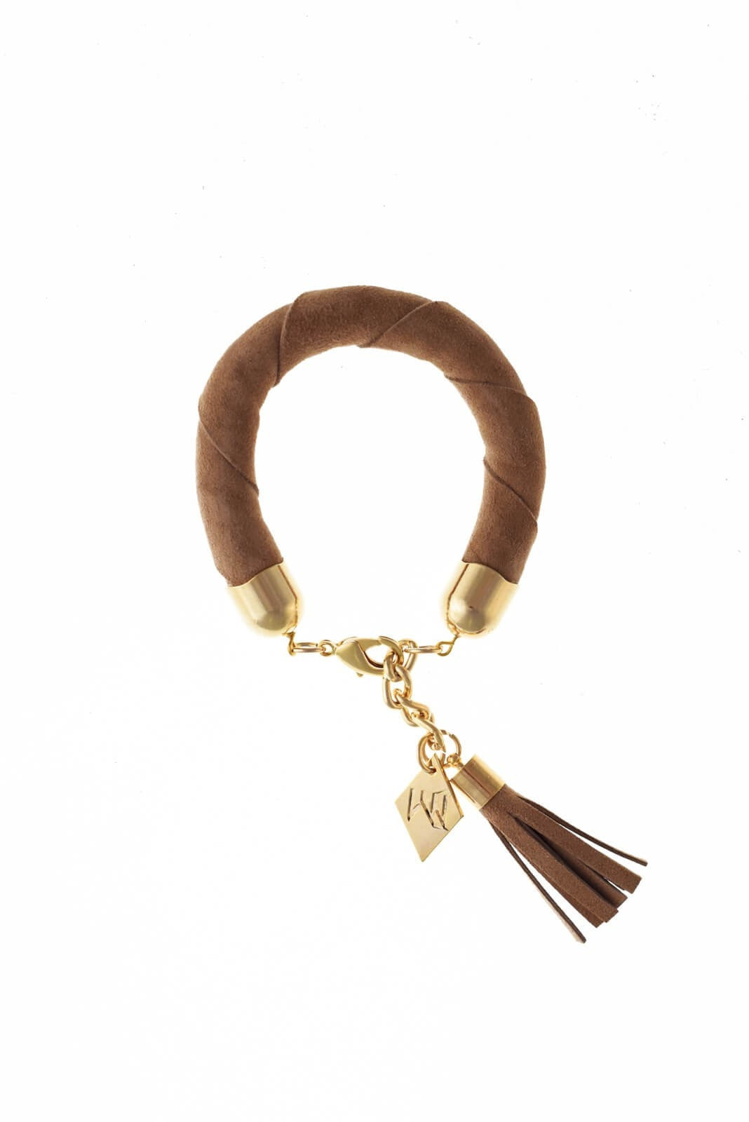 The no. 5 edition of the handcuff bracelet is made of beige suede with galvanized metal components with leather tassel. Gold edition.