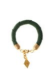 The no. 18 edition of the handcuff bracelet is made of green suede with galvanized metal components. Gold edition.
