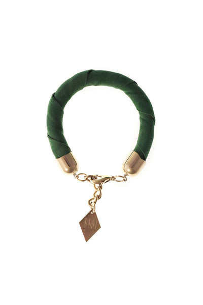 The no. 18 edition of the handcuff bracelet is made of green suede with galvanized metal components. Silver edition.