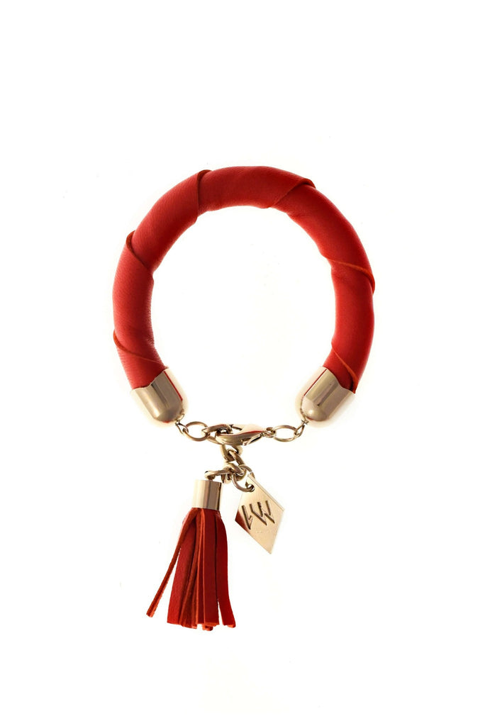 The no. 19 edition of the handcuff bracelet is made of red leather with galvanized metal components with leather tassel.