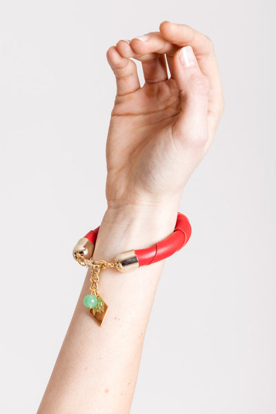 The no. 19 edition of the handcuff bracelet is made of red leather with galvanized metal components with aventurine.