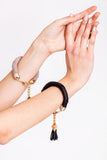 The no. 5 edition of the handcuff bracelet is made of beige suede with galvanized metal components without leather tassel. In combination with no. 4.