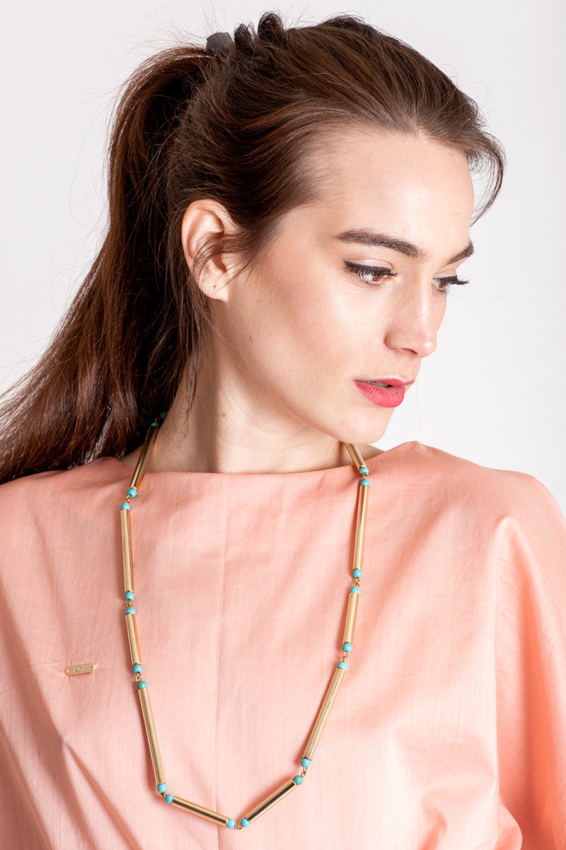 Hidden lines long necklace made of hand-cut, hand polished and galvanized brass featuring turquoise. 