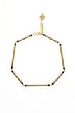 Hidden Lines necklace is made of hand-cut and galvanized brass and onyx.