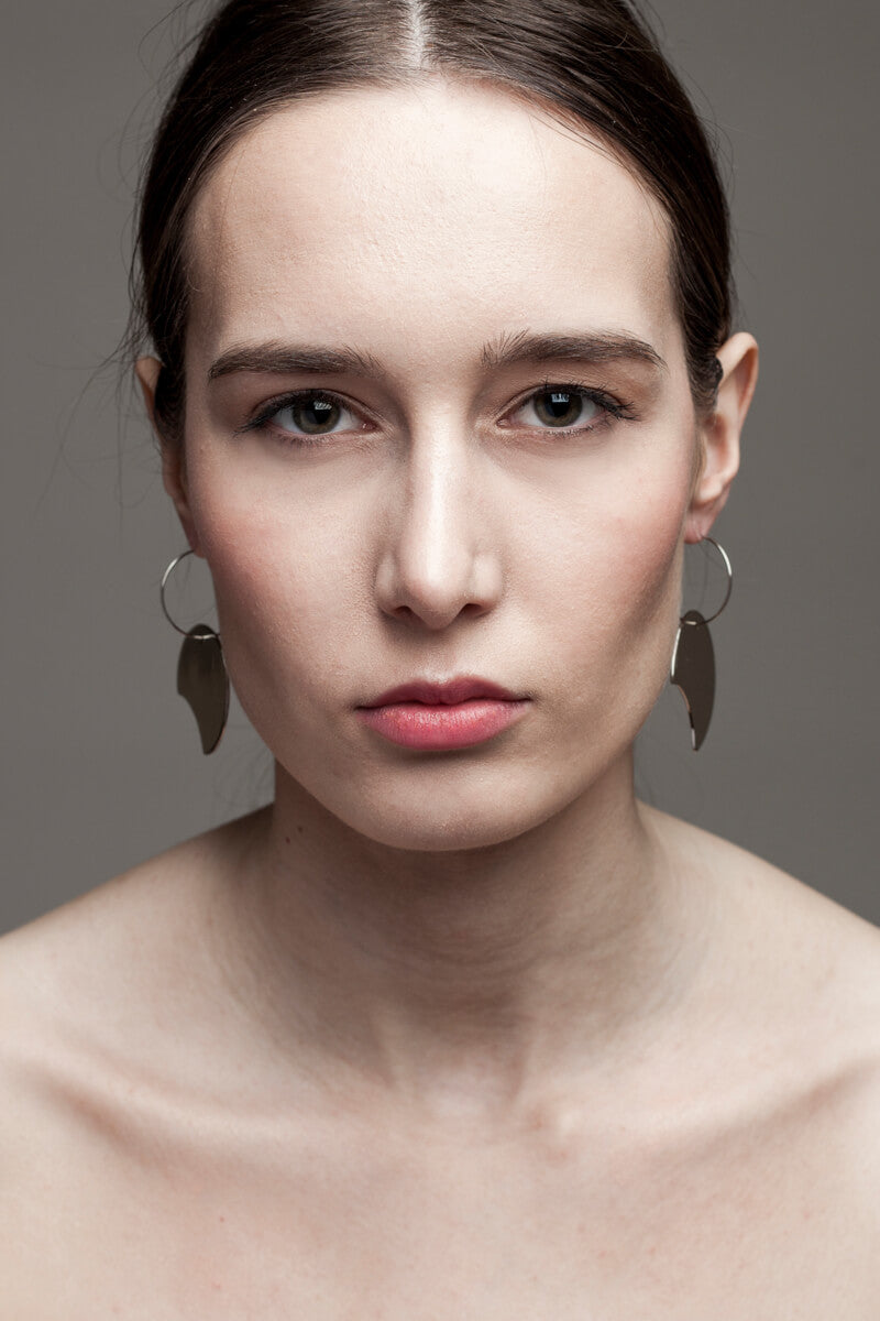 Earrings made of brass galvanized in silver.