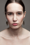Earrings made of brass galvanized in silver.