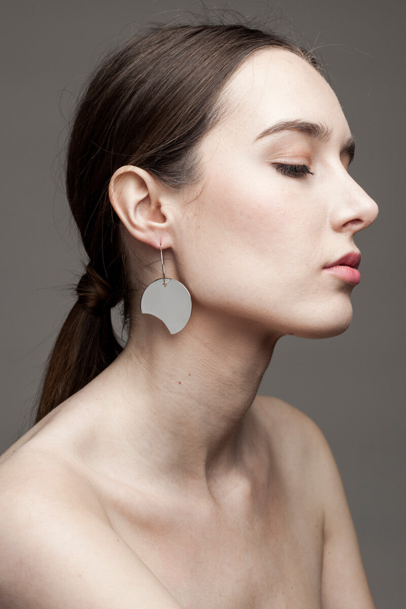 Earrings made of brass galvanized in silver.