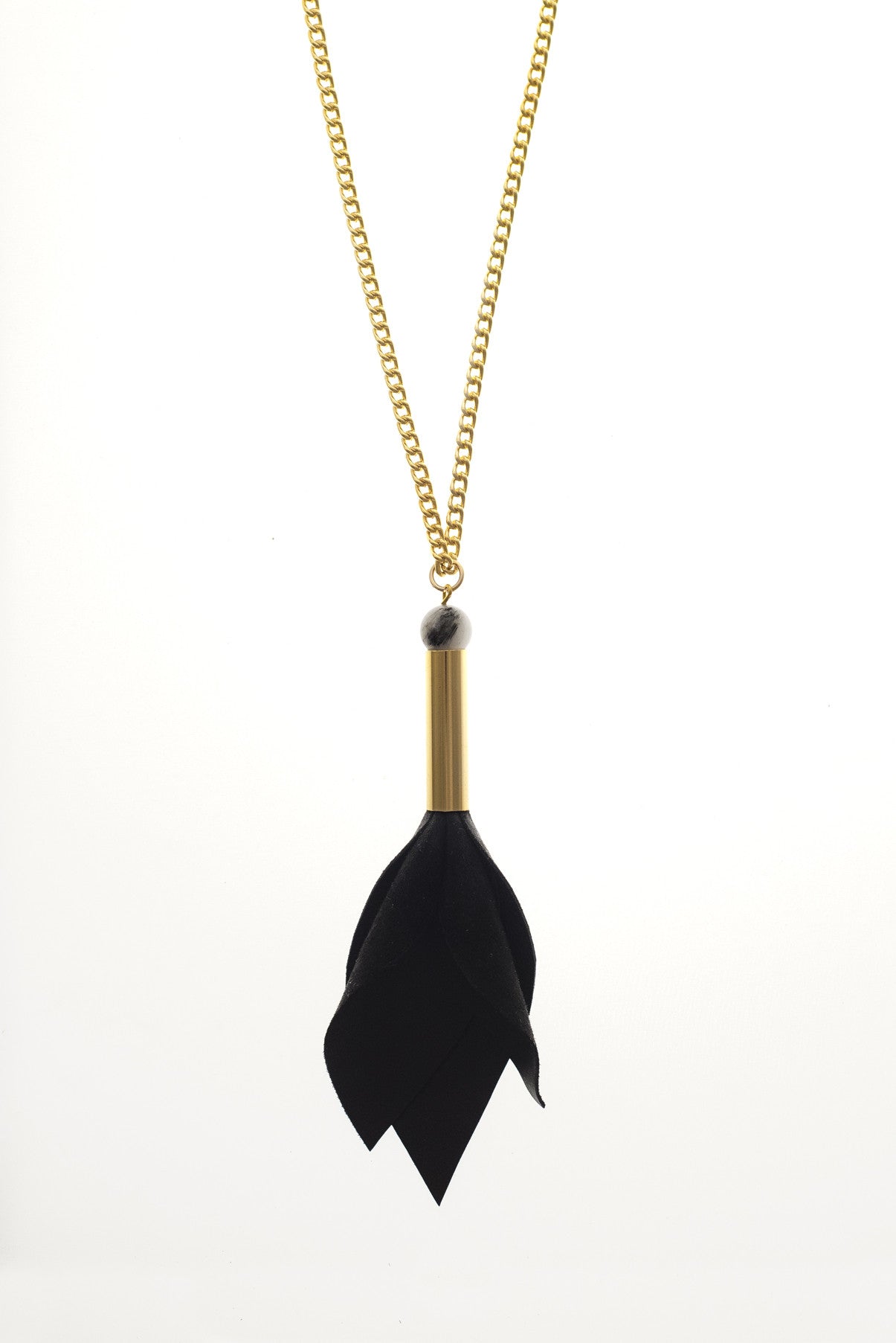 This long tulip necklace is made of hand-cut black leather, hand-cut and galvanized brass, rutilated quartz and galvanized metal components.