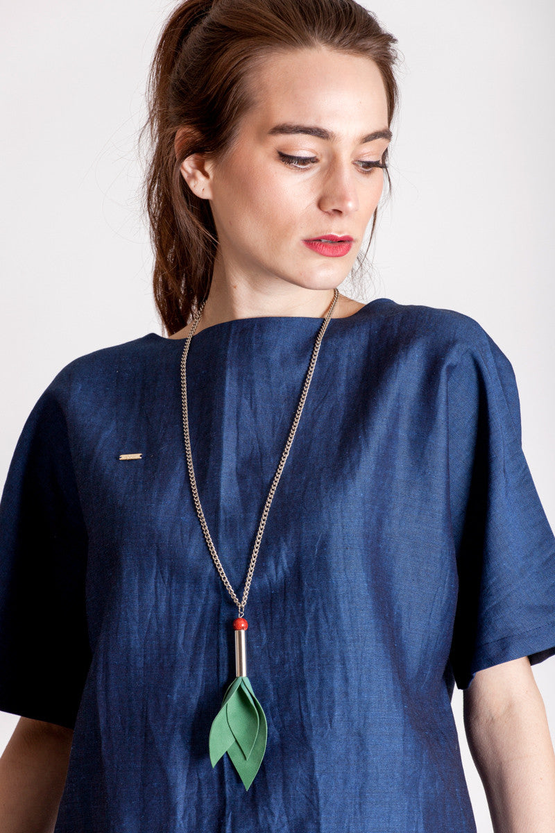 Tulip necklace made of hand-cut green leather, hand-cut and galvanized brass, coral and galvanized metal components.