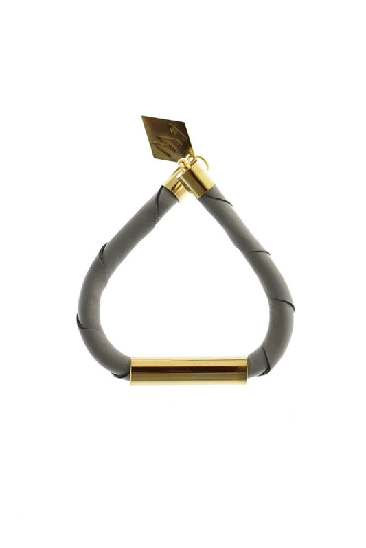 Line cuff made of light gray leather and hand-cut, hand polished and galvanized brass. Gold edition.