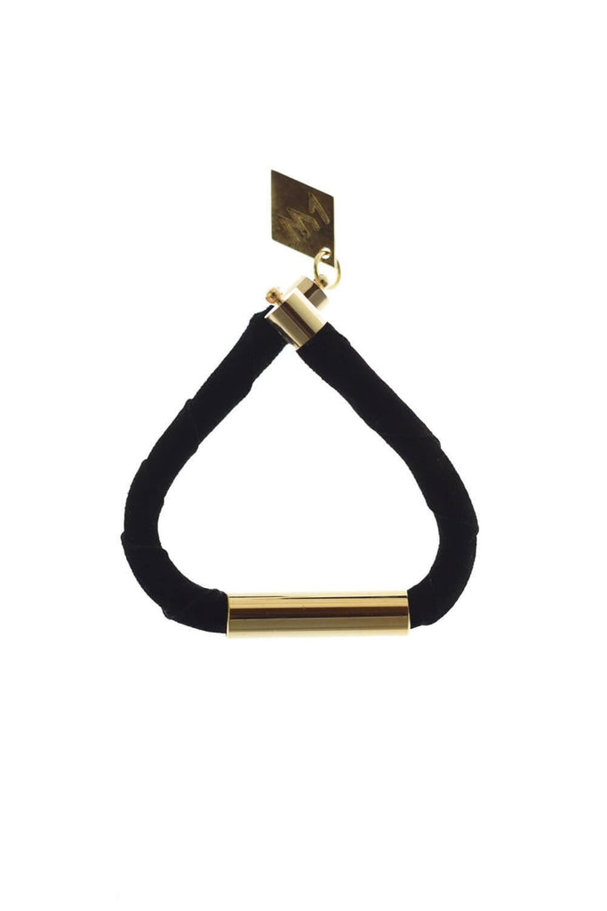 Line cuff made of black suede and hand-cut, hand polished and galvanized brass. Gold edition.