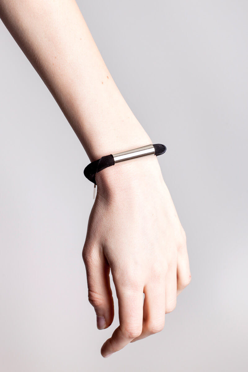 Line cuff made of black suede and hand-cut, hand polished and galvanized brass. Silver edition.