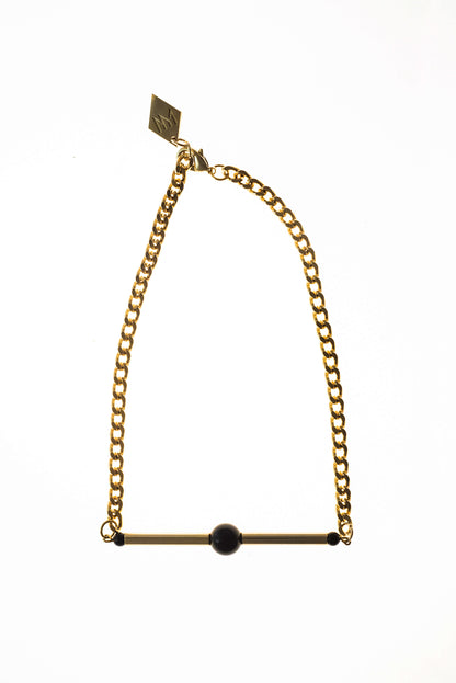 Line necklace made of hand-cut and 24K gold-plated brass, onyx and 24K gold-plated metal components.