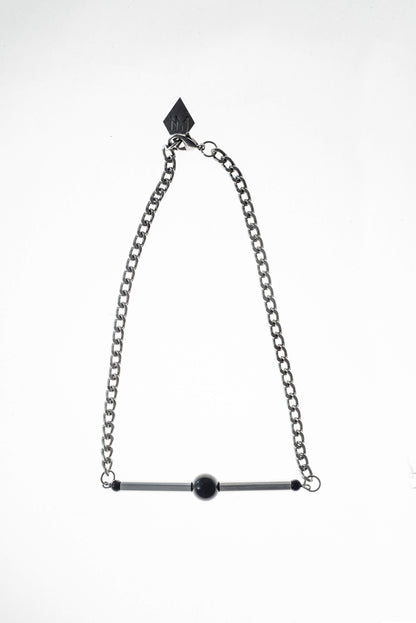 Line necklace made of hand-cut and galvanized brass, onyx and galvanized metal components.