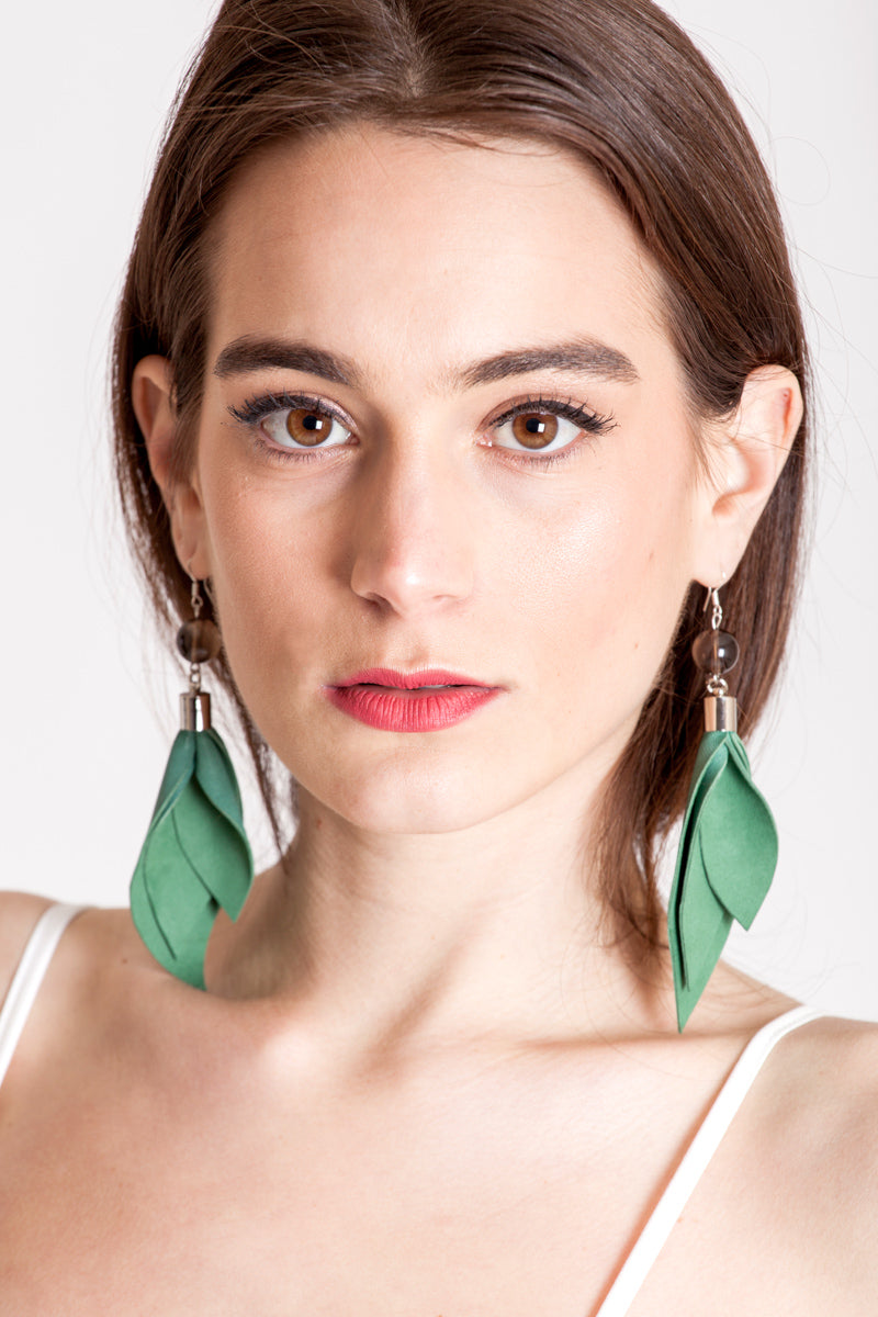 Leaf earrings made of hand-cut green leather, galvanized brass, smokey quartz and sterling silver.
