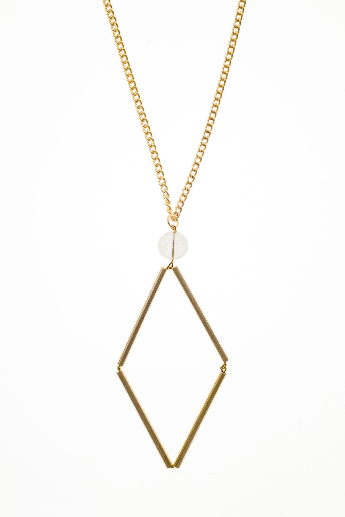 This Norma necklace features hand-cut, hand polished and galvanized brass and quartz.