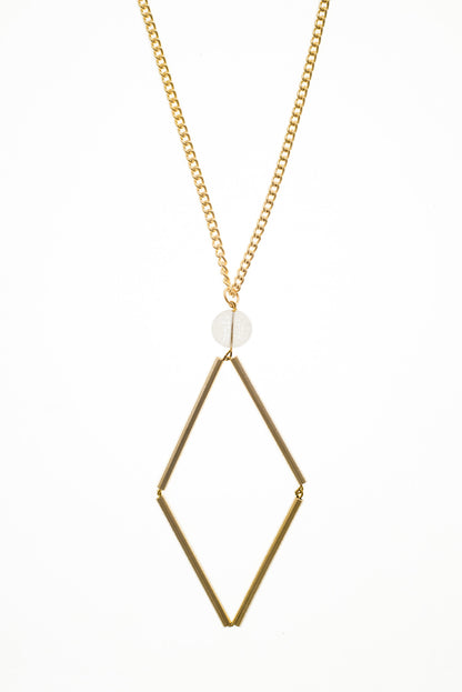 This Norma necklace features hand-cut, hand polished and galvanized brass and quartz.