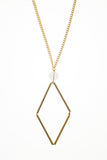 This Norma necklace features hand-cut, hand polished and galvanized brass and quartz.