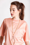 This Norma necklace features hand-cut, hand polished and galvanized brass and quartz.