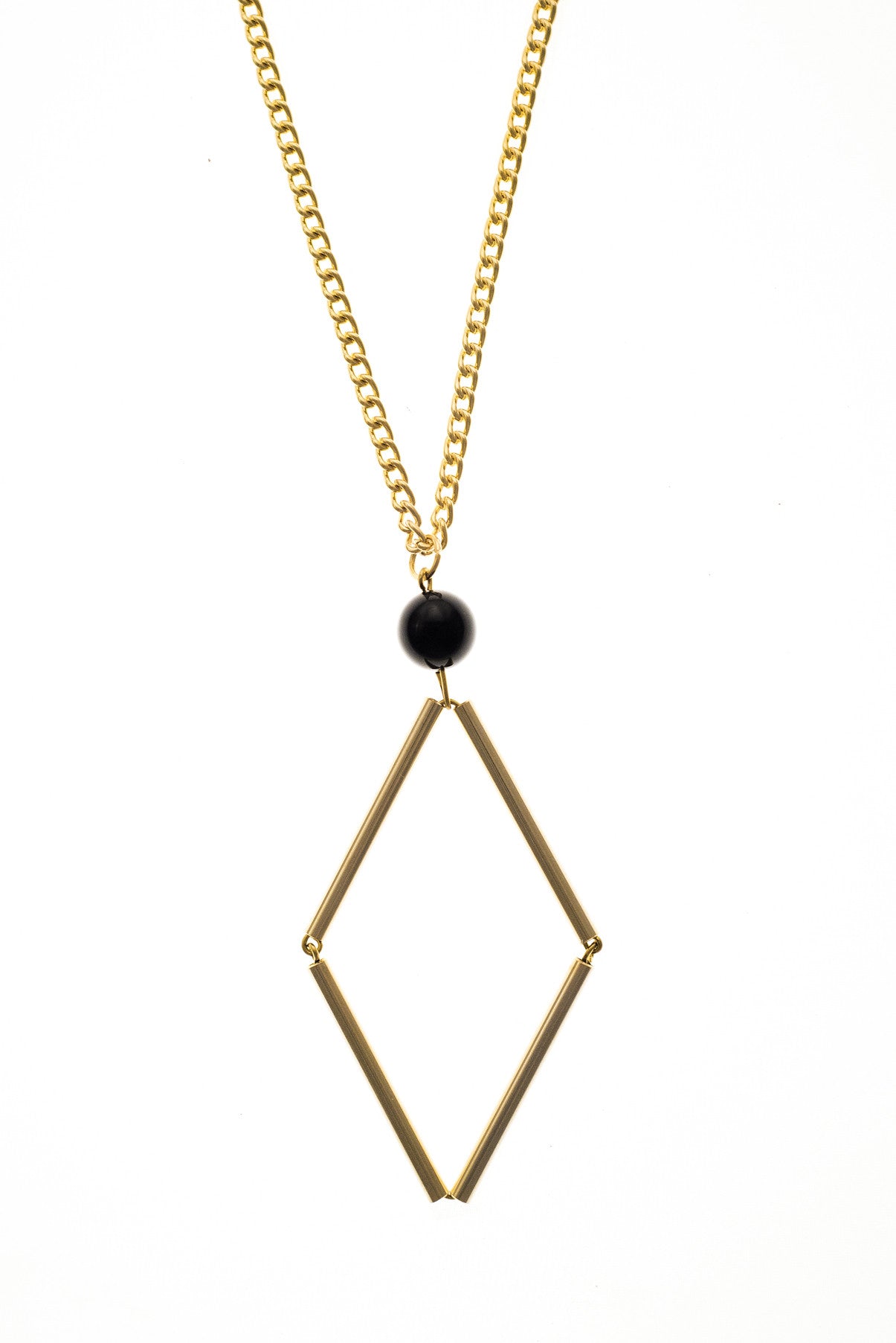 Norma necklace small features hand-cut, hand polished and galvanized brass and onyx. 