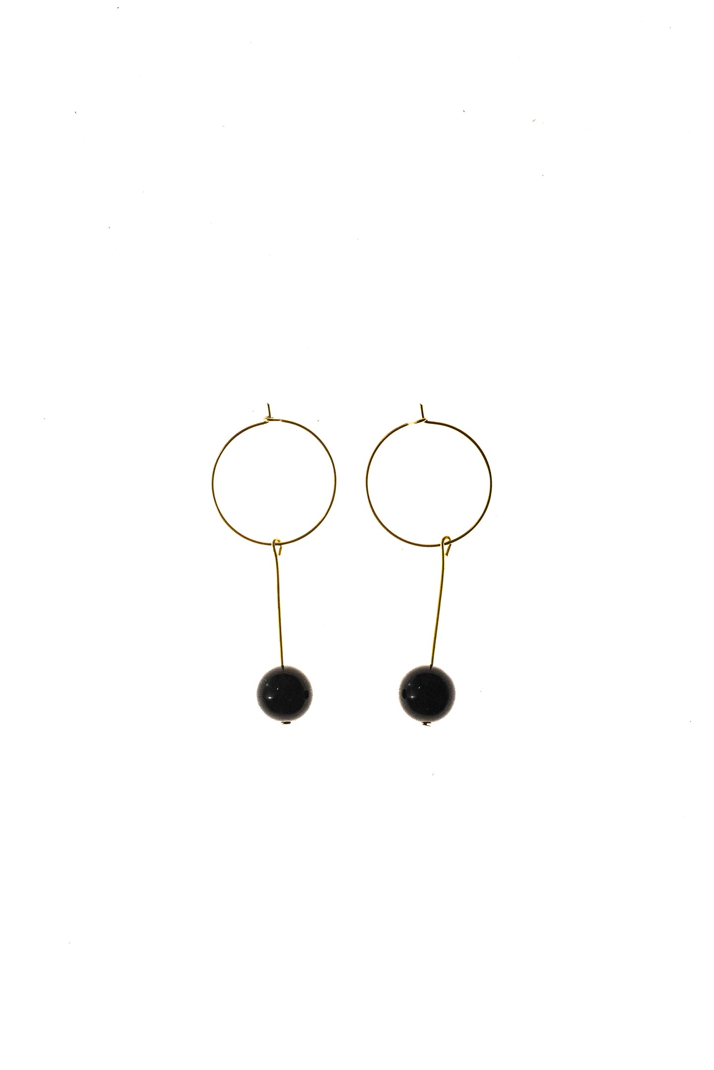 Earrings made of 24K gold plated brass and onyx.