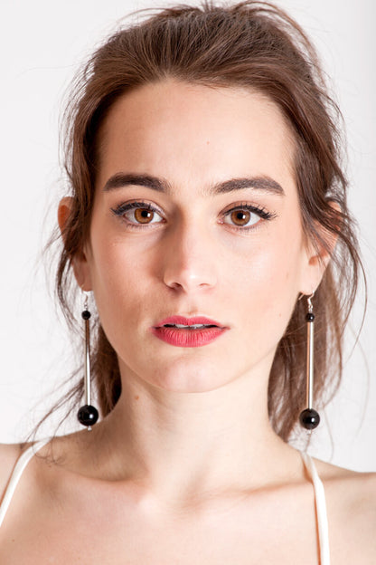 Bellevue earrings made of hand-cut, hand polished and galvanized brass, onyx and sterling silver.