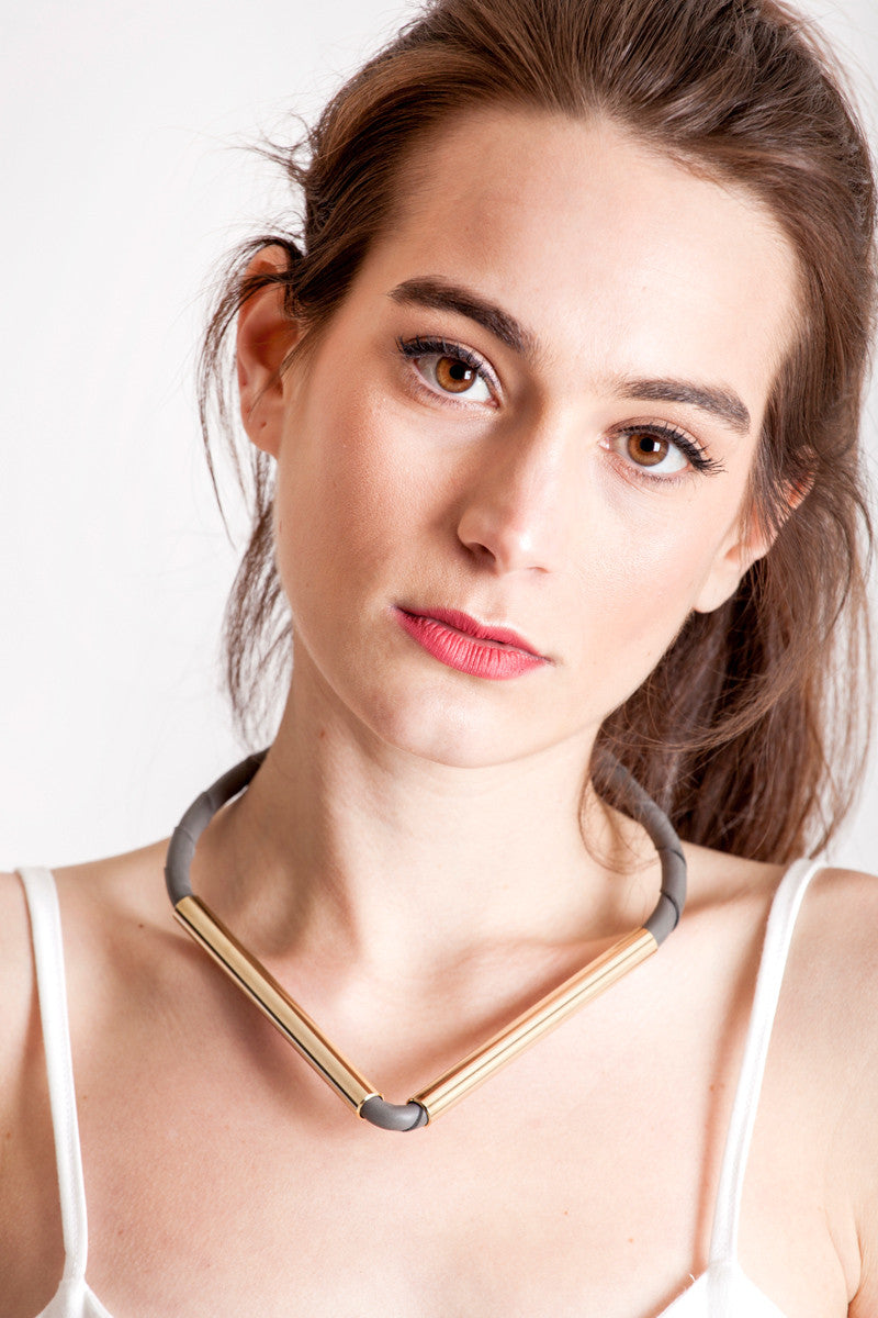 Triangle necklace made of finest gray leather and hand-cut, hand-polished and galvanized brass.