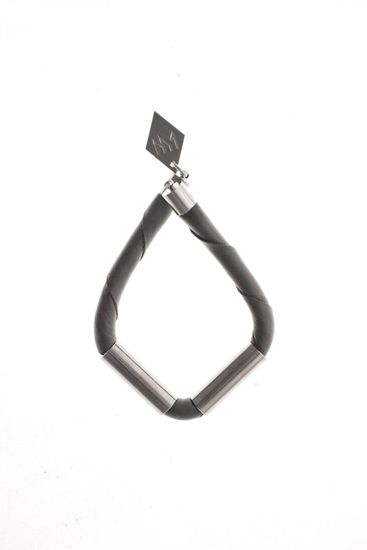 Triangle cuff made of leather and hand-cut, hand polished and galvanized brass.