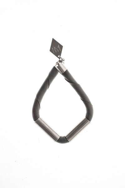 Triangle cuff made of leather and hand-cut, hand polished and galvanized brass.