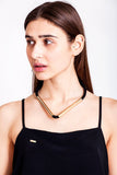 Triangle necklace made of the finest leather, hand-cut, hand polished and galvanized brass. Gold edition.