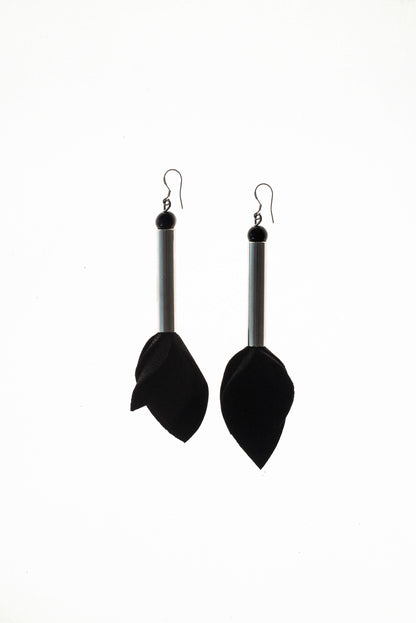 Earrings made of hand-cut leather, galvanized brass, onyx and sterling silver. 